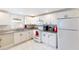 Efficient kitchen with white cabinetry, granite countertops, and modern appliances offers a functional space at 1087 Longley Nw Ave, Atlanta, GA 30318