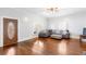 Bright living room featuring hardwood floors, neutral walls, and a comfortable sofa at 1087 Longley Nw Ave, Atlanta, GA 30318