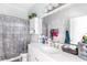 Bathroom featuring a combination shower and tub and a vanity and a large mirror at 1091 Longley Nw Ave, Atlanta, GA 30318