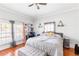 Bright bedroom featuring hardwood floors, two large windows, and neutral colored decor at 1091 Longley Nw Ave, Atlanta, GA 30318