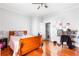 Bright bedroom with a wood bed frame, pink accents, and views of the outdoors at 1091 Longley Nw Ave, Atlanta, GA 30318