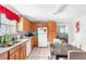 Bright kitchen featuring light wood cabinets, granite countertops, and stainless-steel appliances at 1091 Longley Nw Ave, Atlanta, GA 30318