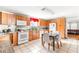 Open kitchen with stainless steel appliances, dining area, and access to the living room at 1091 Longley Nw Ave, Atlanta, GA 30318