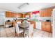 Traditional kitchen with an eat-in area that includes a wooden table and white chairs at 1091 Longley Nw Ave, Atlanta, GA 30318