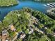 A view of lake houses nestled amongst the trees near a local marina at 1875 Bernice Dr, Cumming, GA 30041