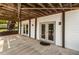 A covered back patio with concrete flooring at 1875 Bernice Dr, Cumming, GA 30041