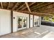 A covered back patio with concrete flooring at 1875 Bernice Dr, Cumming, GA 30041