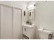 Bright bathroom featuring a vanity with modern fixtures and a toilet at 1875 Bernice Dr, Cumming, GA 30041