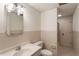 Cozy bathroom featuring a single sink, decorative lighting, and shower, providing convenience and style at 1875 Bernice Dr, Cumming, GA 30041