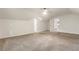 Bright and spacious bedroom featuring neutral carpet and paint with multiple access doors at 1875 Bernice Dr, Cumming, GA 30041