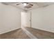 This carpeted bedroom offers a ceiling fan, natural light, and a cozy atmosphere, ideal for relaxation at 1875 Bernice Dr, Cumming, GA 30041