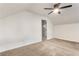 Slanted ceiling bedroom with neutral carpet, a ceiling fan, and a doorway at 1875 Bernice Dr, Cumming, GA 30041