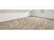 View of a bright bedroom featuring neutral carpet and paint with a window at 1875 Bernice Dr, Cumming, GA 30041
