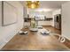 Dining area with decorative light fixture is adjacent to the kitchen with stainless steel appliances at 1875 Bernice Dr, Cumming, GA 30041