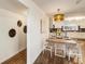 Dining room with table and chairs next to modern kitchen at 1875 Bernice Dr, Cumming, GA 30041