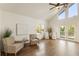 Bright living room featuring high ceilings, hardwood floors, and a walkout deck at 1875 Bernice Dr, Cumming, GA 30041