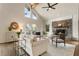 Bright living room with stone fireplace, high ceilings, and hardwood floors at 1875 Bernice Dr, Cumming, GA 30041
