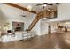 Spacious living room with stone fireplace, hardwood floors, and elegant decor at 1875 Bernice Dr, Cumming, GA 30041
