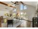 Bright living room with fireplace, high ceilings, and access to a deck at 1875 Bernice Dr, Cumming, GA 30041