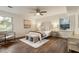 Bright primary bedroom with hardwood floors, white walls, and natural light at 1875 Bernice Dr, Cumming, GA 30041