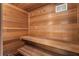 A sauna featuring a wood lined walls, benches, and floors at 1875 Bernice Dr, Cumming, GA 30041