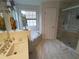 Bathroom featuring a vanity, soaking tub, and separate glass shower at 3060 Baymount Dr, Lawrenceville, GA 30043