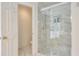 Modern bathroom featuring a glass-enclosed shower with tiled walls at 3060 Baymount Dr, Lawrenceville, GA 30043