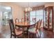 Formal dining room with hardwood floors, a chandelier, and a wooden dining table with six chairs at 3060 Baymount Dr, Lawrenceville, GA 30043