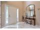 Elegant foyer with marble floors, a tall mirror, and a bright white front door with sidelights at 3060 Baymount Dr, Lawrenceville, GA 30043