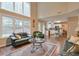 Open floorplan with hardwood floors, fireplace, comfortable seating, and an open view to the kitchen at 3060 Baymount Dr, Lawrenceville, GA 30043