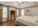 Bright main bedroom with tray ceilings, hardwood floors, and natural light at 3060 Baymount Dr, Lawrenceville, GA 30043