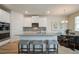 Modern kitchen with granite countertops, stainless steel appliances and seating at the island at 1109 Georgian Point Dr, Lawrenceville, GA 30045