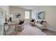 Bright office space with plush seating, a glass desk, and modern artwork at 1109 Georgian Point Dr, Lawrenceville, GA 30045