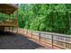 Picture of fenced backyard showcasing wooded area, providing a serene and private outdoor space at 1185 Gallatin Way, Suwanee, GA 30024