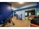 Spacious finished basement with modern exercise equipment, and neutral flooring at 1185 Gallatin Way, Suwanee, GA 30024
