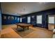 Finished basement featuring a pool table, movie posters, and a cozy seating area at 1185 Gallatin Way, Suwanee, GA 30024
