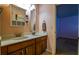 Bathroom featuring double sinks, a vanity, and access to an adjacent bedroom at 1185 Gallatin Way, Suwanee, GA 30024