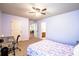 Comfortable bedroom featuring carpet, desk, and ample natural light at 1185 Gallatin Way, Suwanee, GA 30024