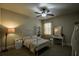 Cozy bedroom with carpet flooring, ceiling fan, and ample natural light at 1185 Gallatin Way, Suwanee, GA 30024