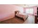 Cozy bedroom with a large window, carpet, and pink walls at 1185 Gallatin Way, Suwanee, GA 30024
