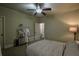 Bedroom with ceiling fan features a door to an additional room or closet for extra space at 1185 Gallatin Way, Suwanee, GA 30024