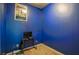 Bedroom featuring a modern TV setup and blue accent walls at 1185 Gallatin Way, Suwanee, GA 30024
