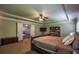 Bedroom with tray ceilings, natural light, and access to other areas in the home at 1185 Gallatin Way, Suwanee, GA 30024