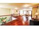 Spacious bonus room with hardwood floors, natural light, and a cozy seating area at 1185 Gallatin Way, Suwanee, GA 30024