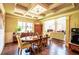 Dining room with coffered ceilings, hardwood floors and multiple windows at 1185 Gallatin Way, Suwanee, GA 30024