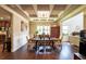Elegant dining room boasts hardwood floors, coffered ceilings, and stylish decor at 1185 Gallatin Way, Suwanee, GA 30024