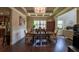 Elegant dining room featuring coffered ceilings, hardwood floors, and wainscoting at 1185 Gallatin Way, Suwanee, GA 30024