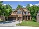 Beautiful brick two-story home featuring an attached two car garage and manicured front yard at 1185 Gallatin Way, Suwanee, GA 30024