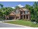 Charming two-story brick home featuring a three-car garage and a well-manicured front lawn at 1185 Gallatin Way, Suwanee, GA 30024