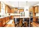 Well-equipped kitchen features an island, stainless steel appliances, and ample counter space at 1185 Gallatin Way, Suwanee, GA 30024